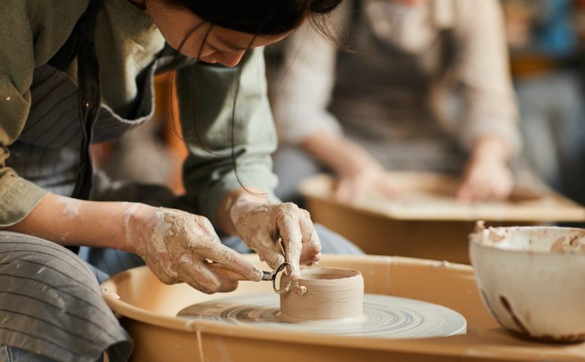 shaping-wet-clay-on-pottery-wheel.jpg